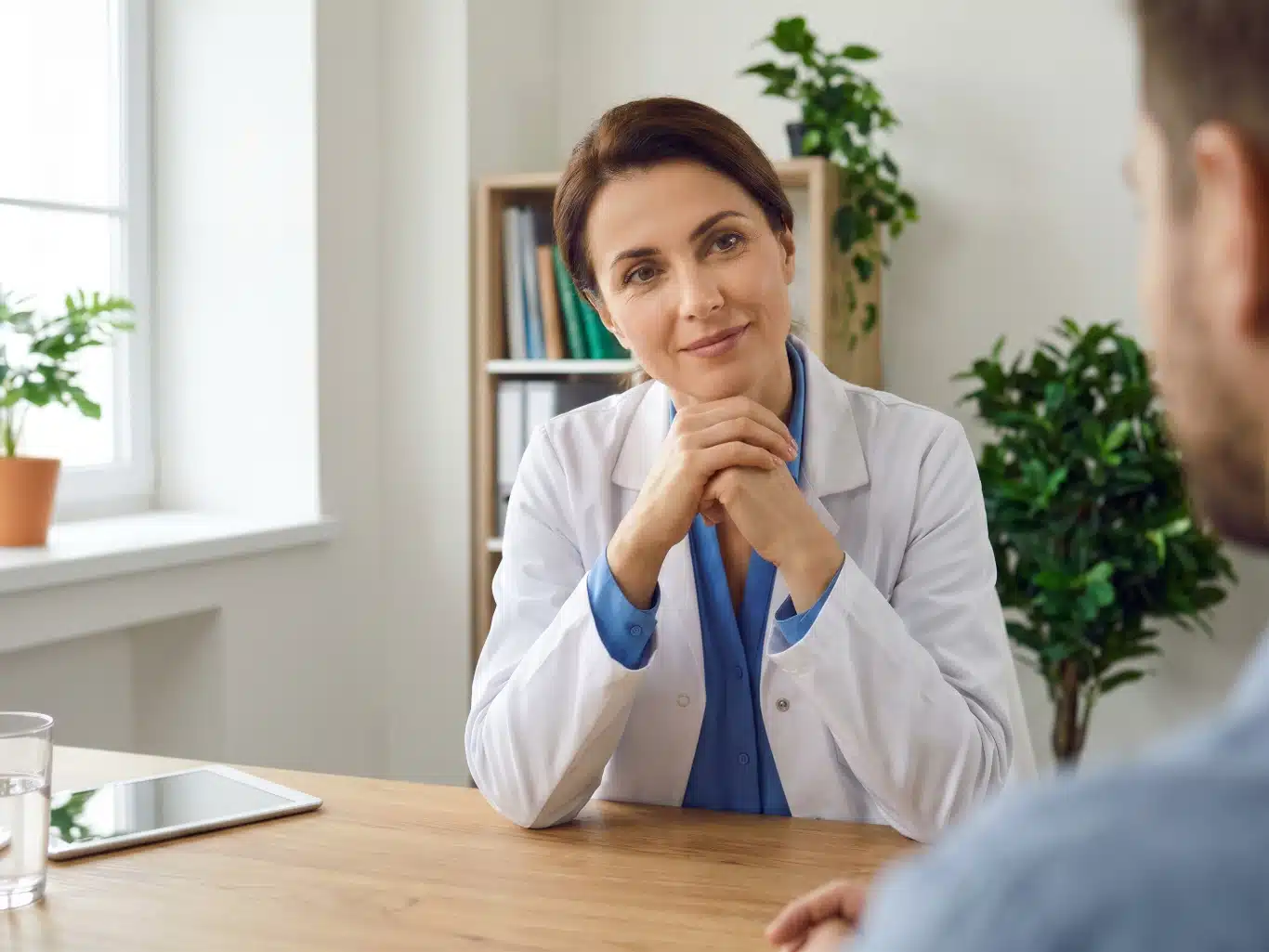 professional a doctor and patient in a consultation with medical records